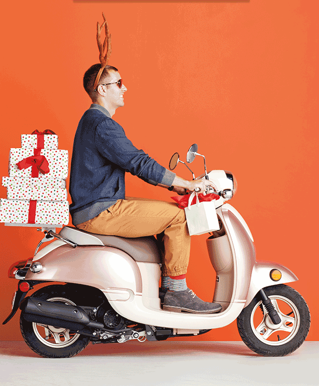 Guy riding soocter with gifts! Guy riding soocter with gifts!