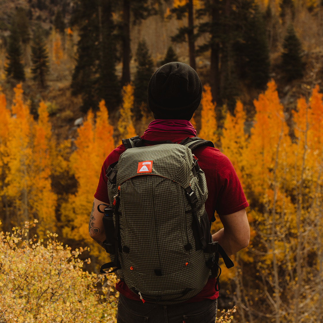 Poler orange clearance label camera backpack