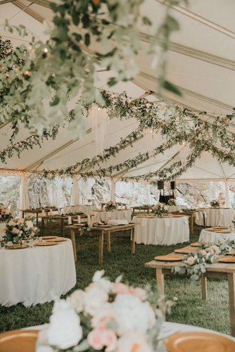 sage green wedding recetion under elegant white tent with greenery t&k photography