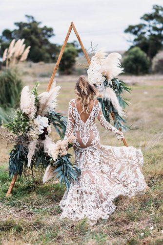 sage green wedding triangle wooden arch bohemian with pampas grass and boho bride peggysaas