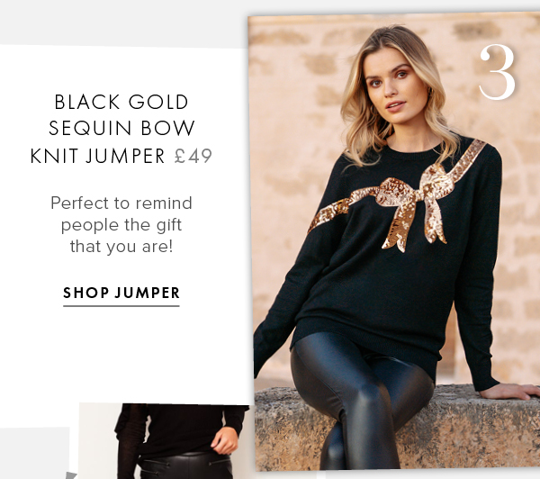 black jumper with gold sequin bow