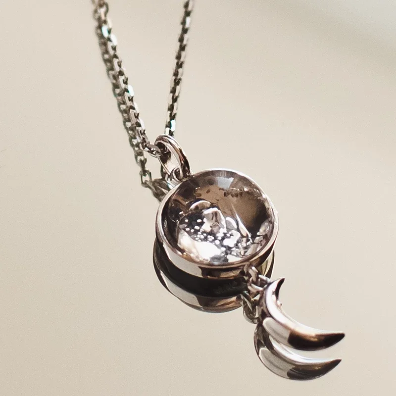 Image of Sterling Silver Swaying Crescent Necklace Made With Moon Meteorite