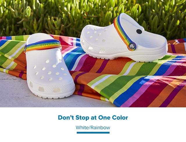 white crocs with rainbow strap