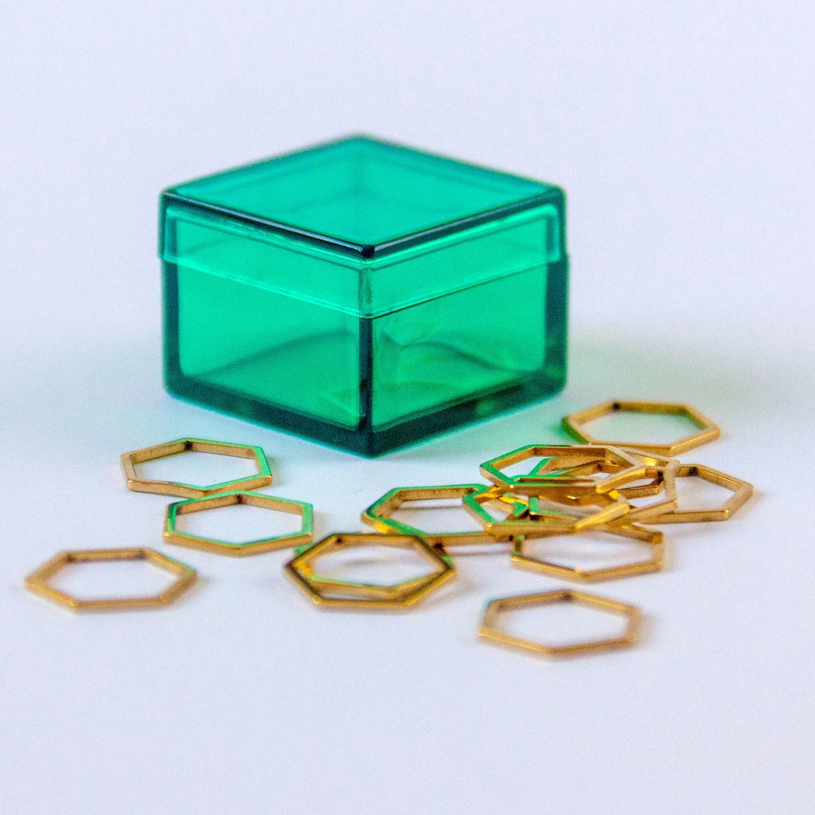 Image of Set of 15 Gold Hexagon Stitch Markers in Emerald Green Storage Box