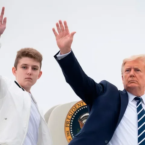 US President Donald Trump and his son Barron wave 