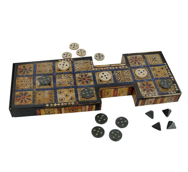 A replica of the Game of Ur, with game board and pieces.