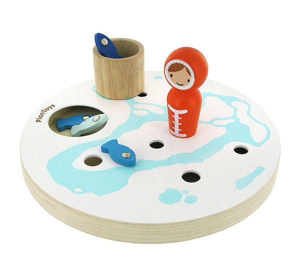 A wooden toy of Arctic ice fishing