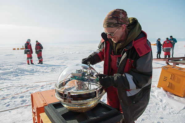 A team member prepares to launch the Baikal Gigaton Volume Detector (Baikal-GVD) deep underwater neutrino telescope built on Lake Baikal.