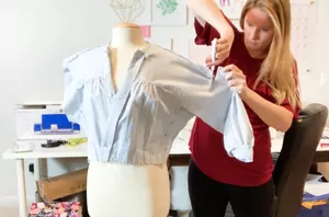 She cut the sleeves off of a thrifted dress and did something so smart to the edges