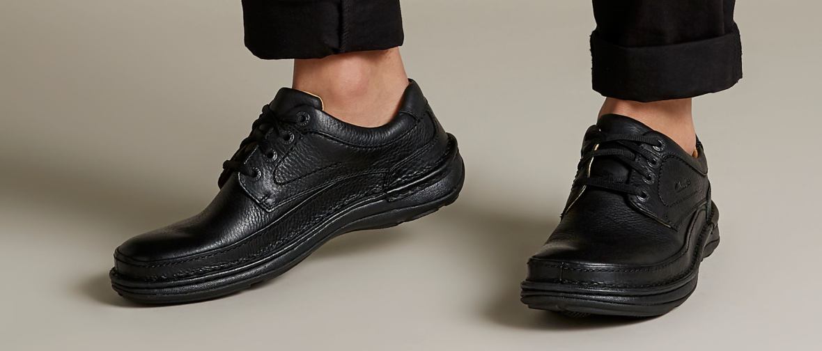 shoes on feet image of Nature Three in black leathe rlinks to product page