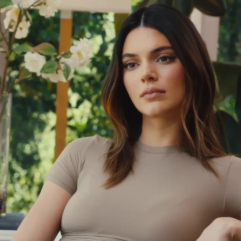 Image may contain: Kendall Jenner, Human, Person, Face, Plant, Female, Flower, Blossom, Clothing, and Apparel