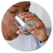 Person drinking glass of water