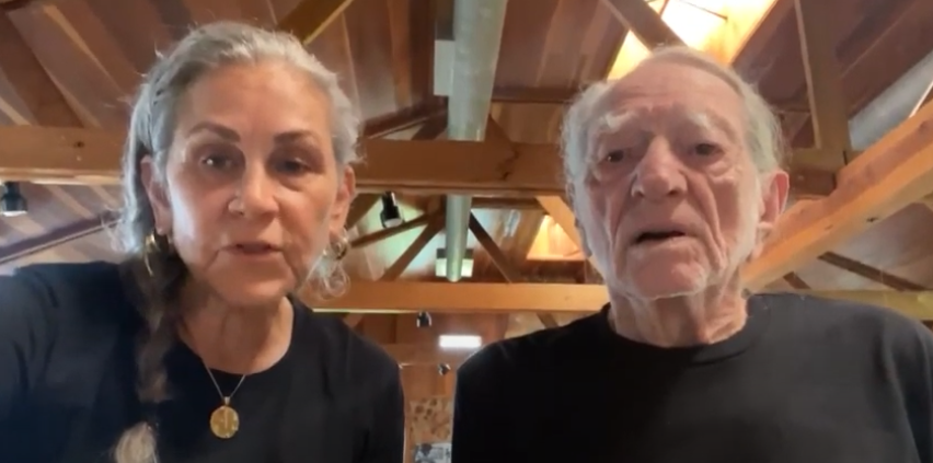 Annie and Willie Nelson looking directly at the camera
