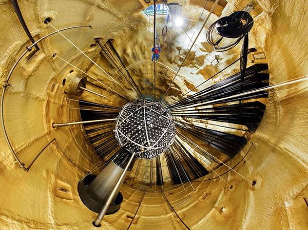 A person hangs inside the SNO+ neutrino laboratory while it's under construction