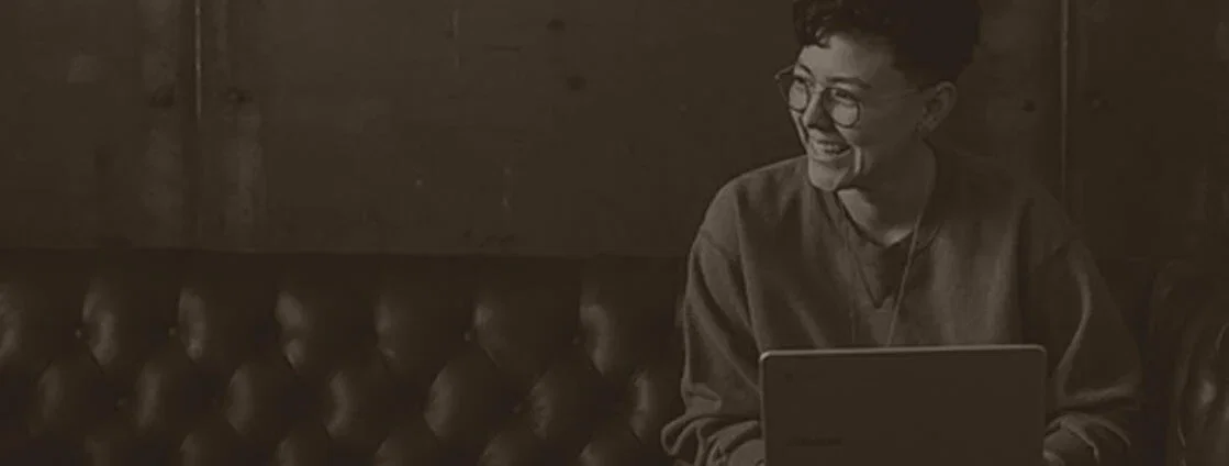 AAII Stock Ideas person with laptop image