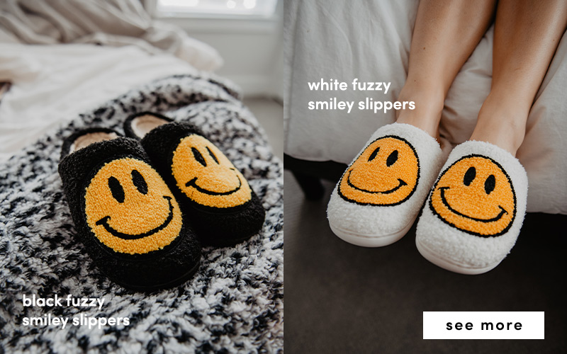 black and white fuzzy smiley slippers