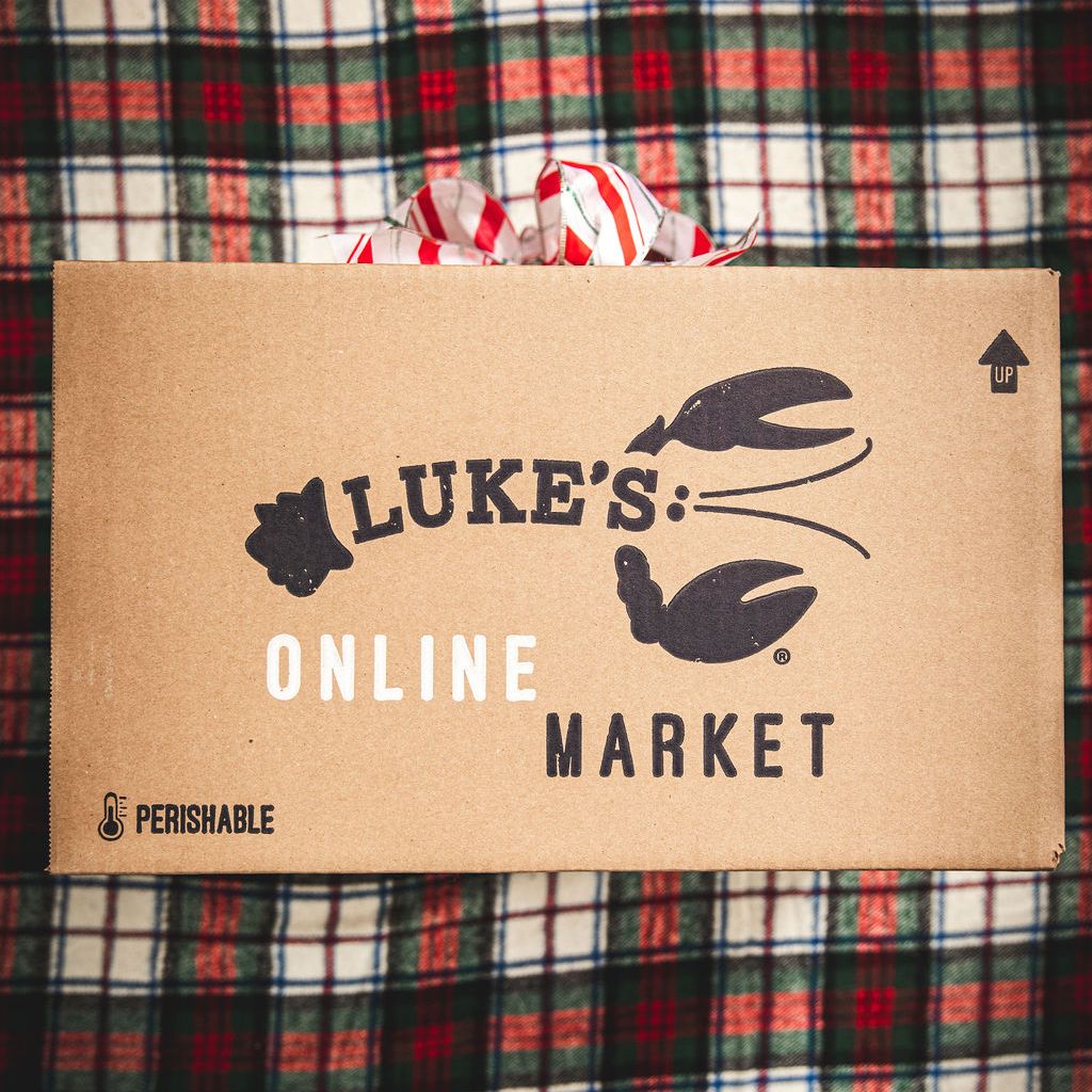 A Luke's Online Market box with a Christmas bow.
