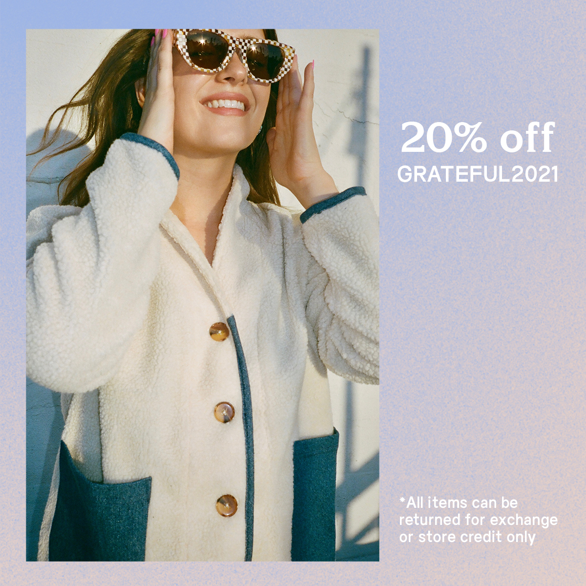 Brunette woman wearing sunglasses and Loup fuzzy ivory jacket with blue denim trim and pockets
