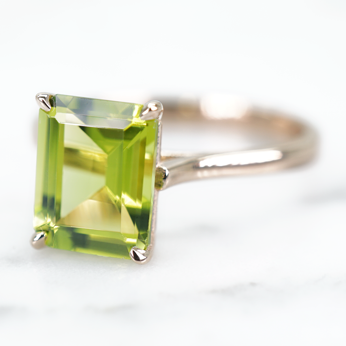 Solitaire Emerald Cut Brhat Peridot Ring in 14K Rose Gold