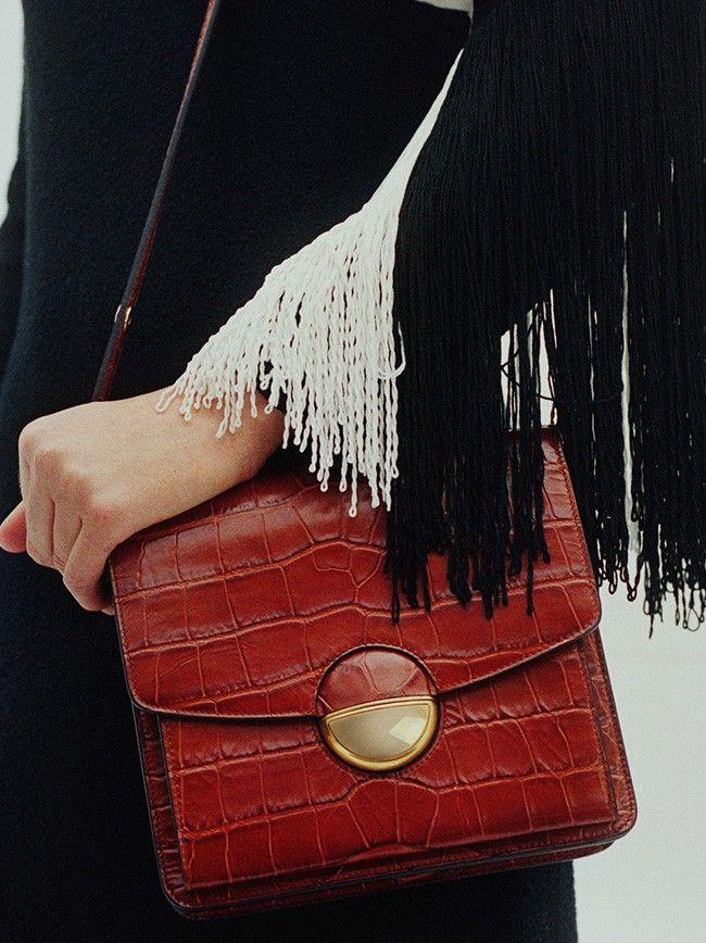 Model in Brown dress with brown Dia Bag