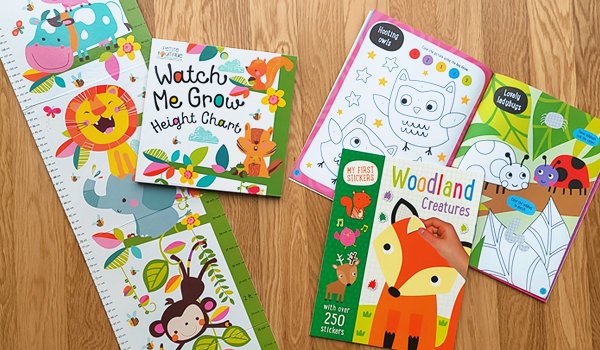 Spread of gift items added in all December Lillypost boxes including the "Watch Me Grow: Height Chart" and the "Woodland Creatures" activity book.