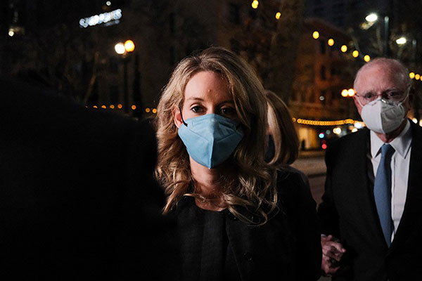 Theranos founder and former chief executive Elizabeth Holmes and her lawyer leave the Federal Building after the verdict was determined.