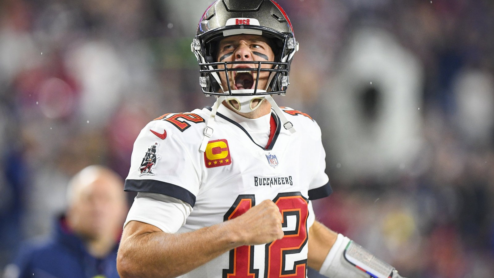Tampa Bay Buccaneers quarterback Tom Brady (12) yells to the crowd as he takes the field to face the New England Patriots at Gillette Stadium.