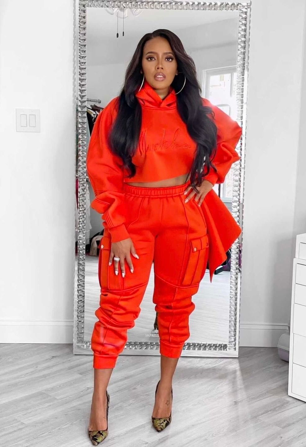 Angela Simmons wears the Signature Slashed Hoodie and matching Come-up Sweatpant
