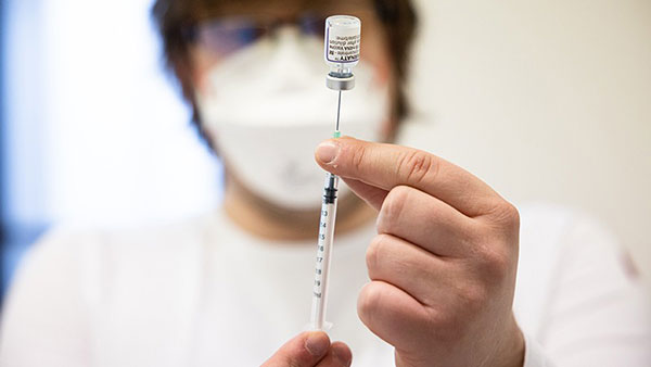 A medical worker prepares a dose of Pfizer-BioNTech COVID-19 vaccine.