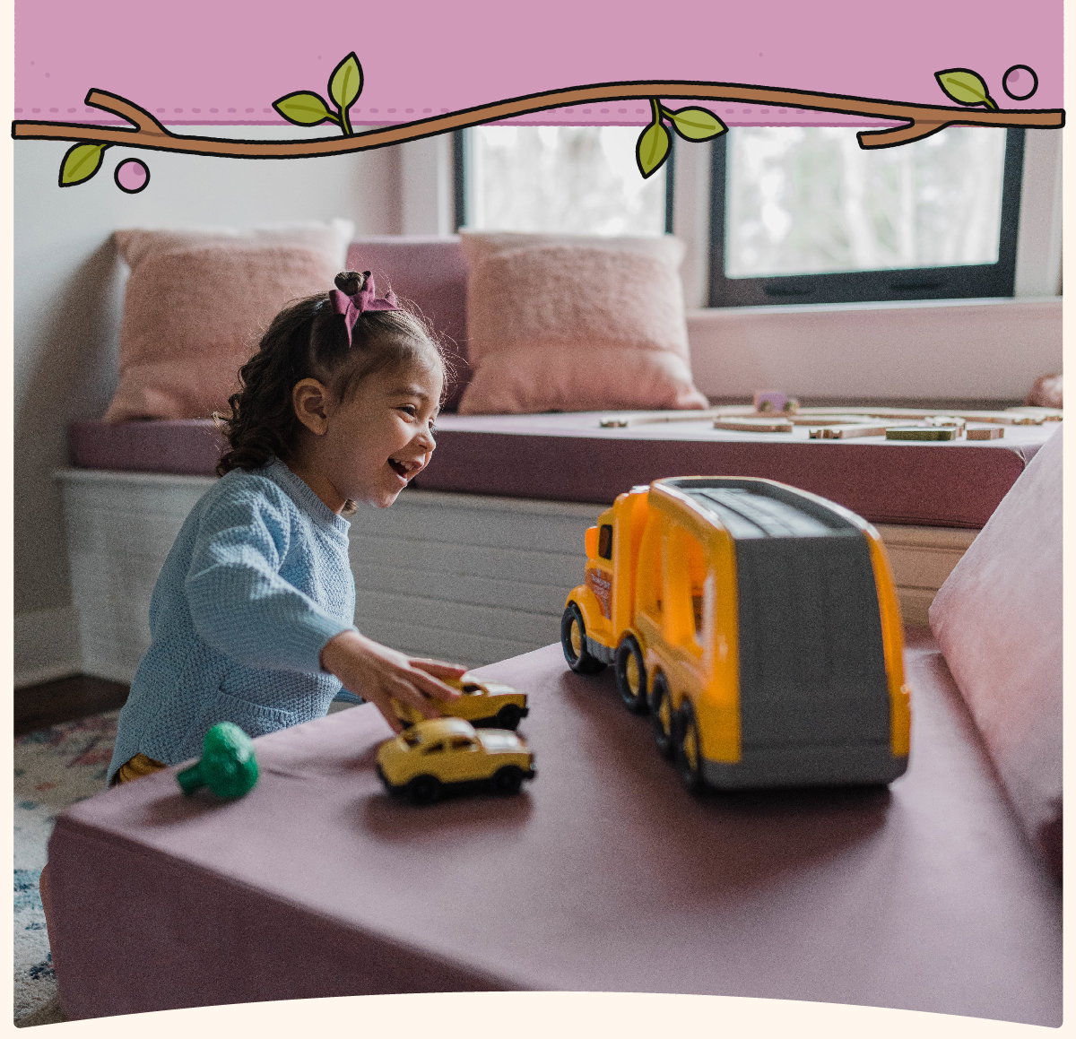 Child plays with toy cars and bus on a Mayberry Nugget