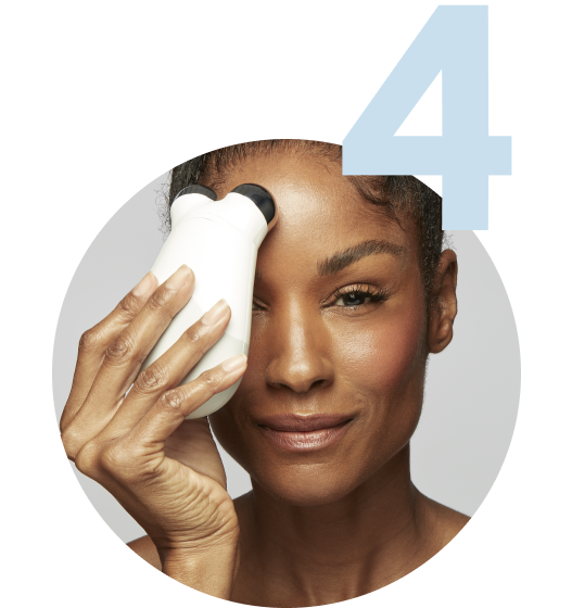 Model using the Trinity Device on her forehead area