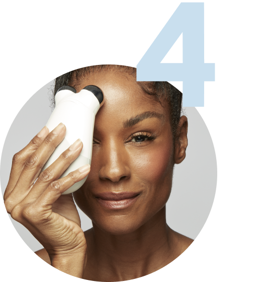Model using the Trinity Device on her forehead area
