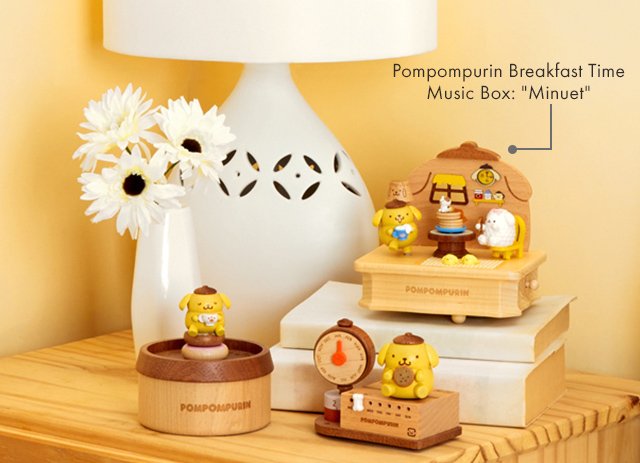 Wooden Pompompurin Music Boxes and Trinket Box on a nightstand next to a lamp