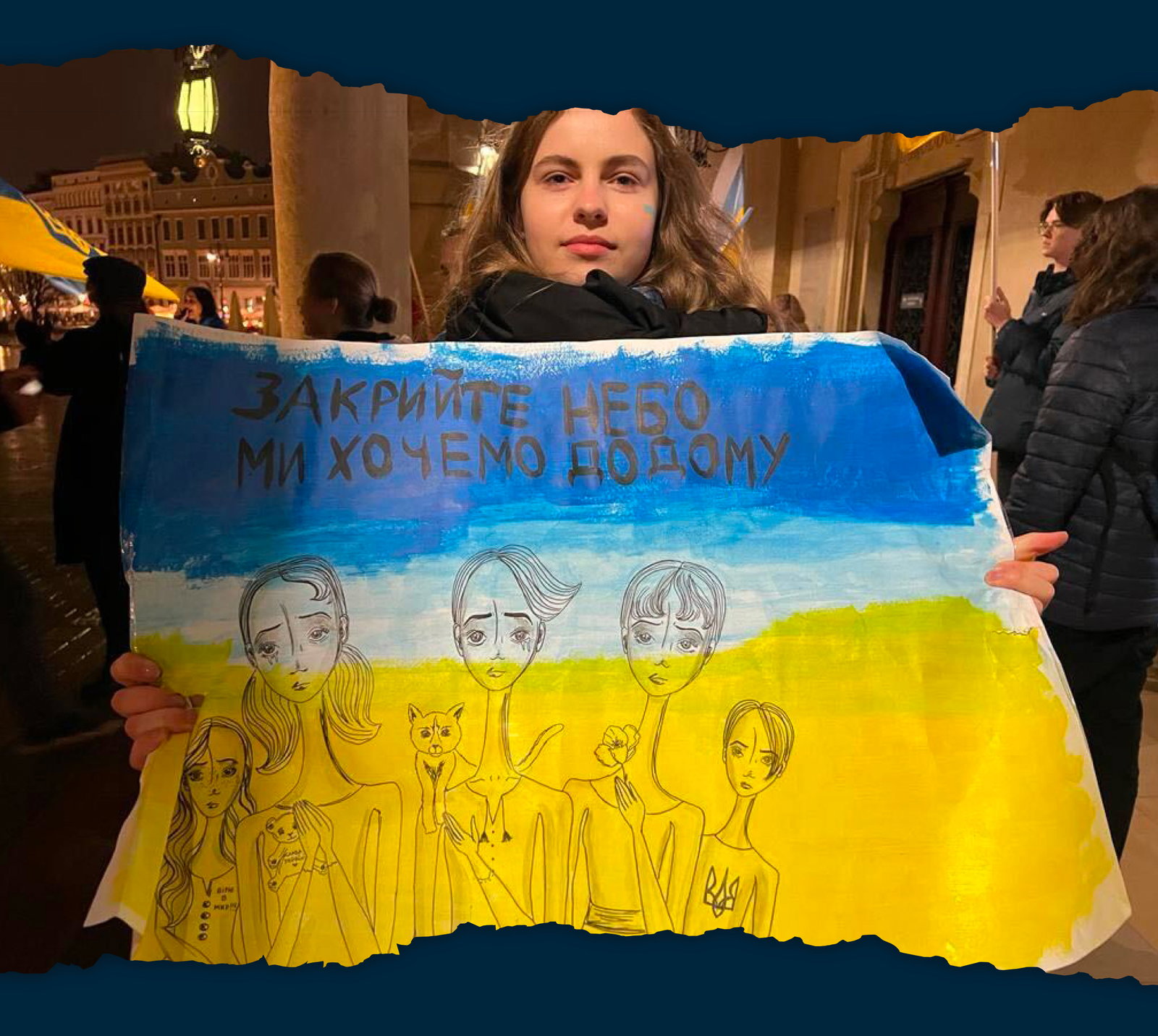 Woman holding her artwork, raising money for the Ukrainian army. 