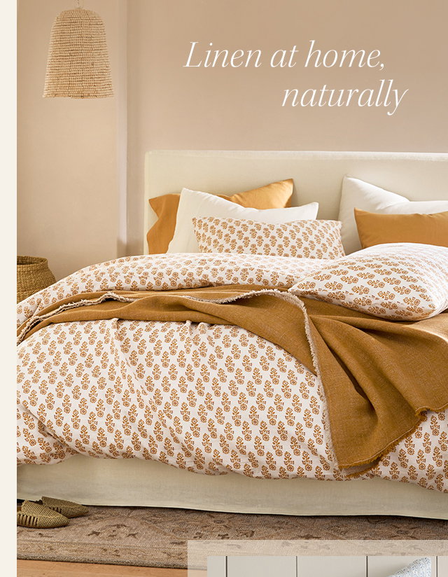 Image of bed with printed linen bedding