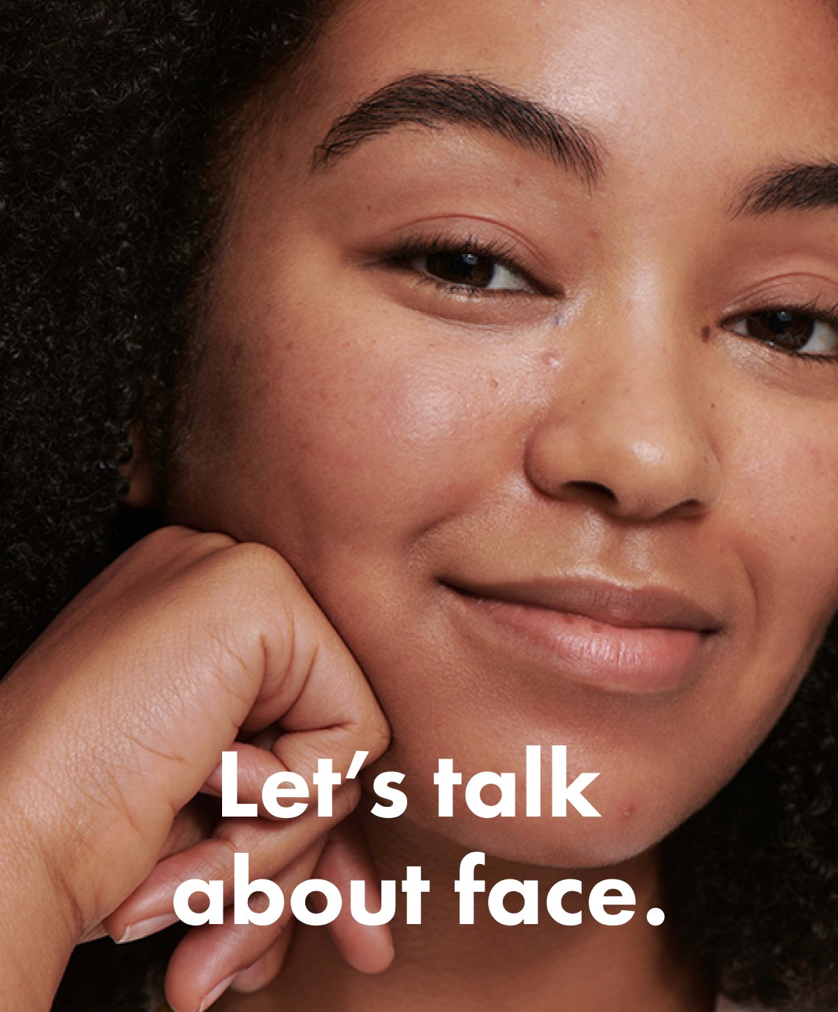 Woman smirking.  Text "Let's talk about face."