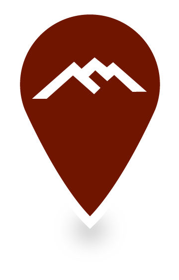 Small red map marker icon with our Darn Tough Vermont mountain logo.