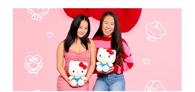 Two people holding Hello Kitty Plush