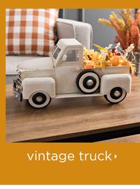 Cream Vintage Truck with Autumn Leaves