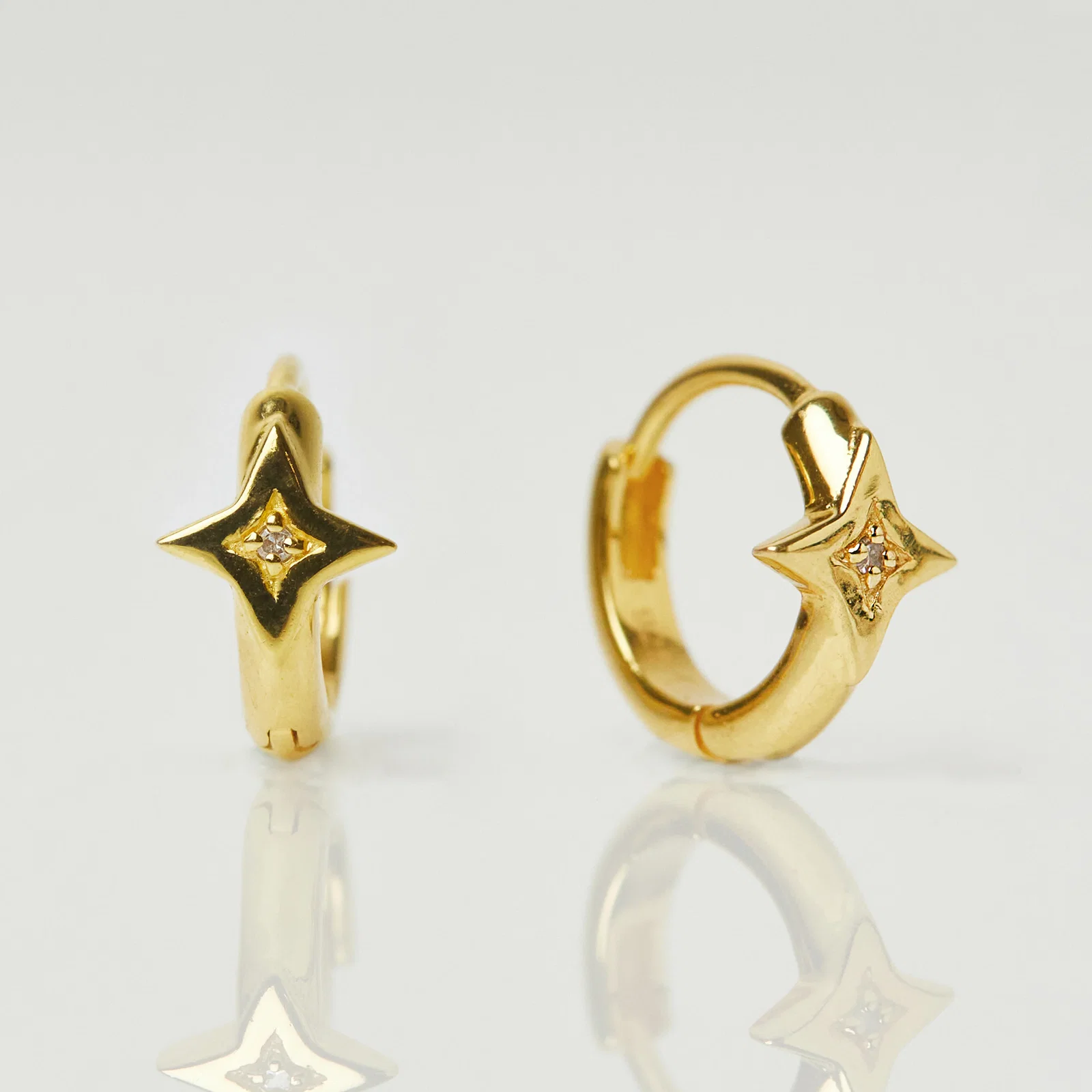 Image of Star Set CZ Huggie Hoops In Gold Vermeil