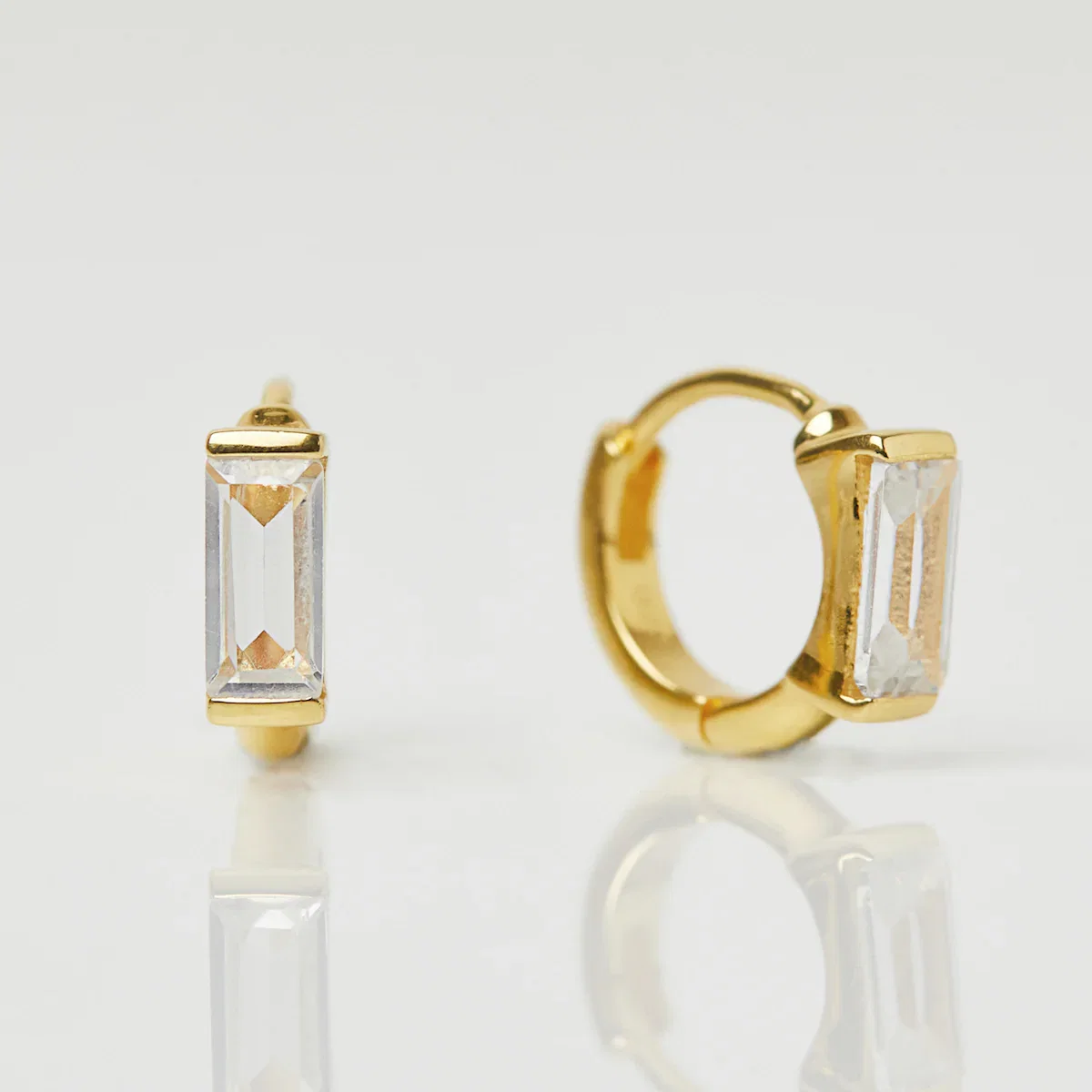 Image of CZ Baguette Huggie Hoops In Gold Vermeil