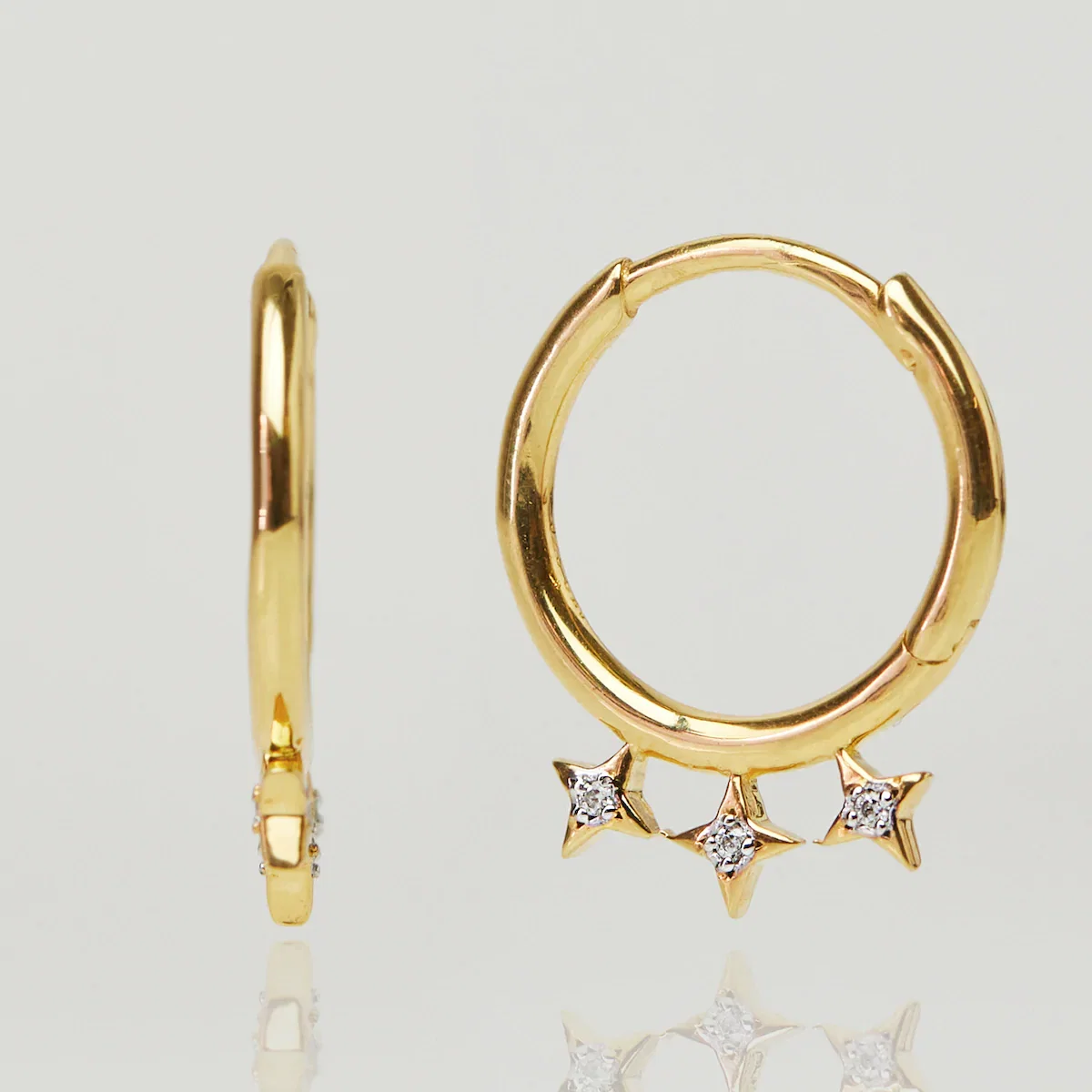 Image of Side Star CZ Drop Hoops In Gold Vermeil