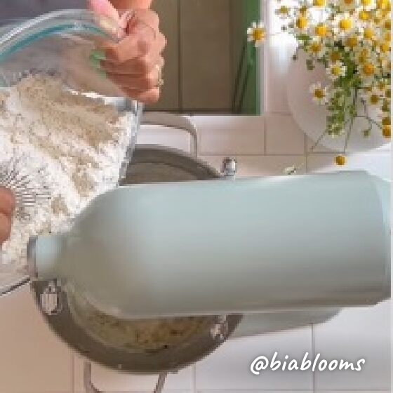 Flour being poured into Stand Mixer