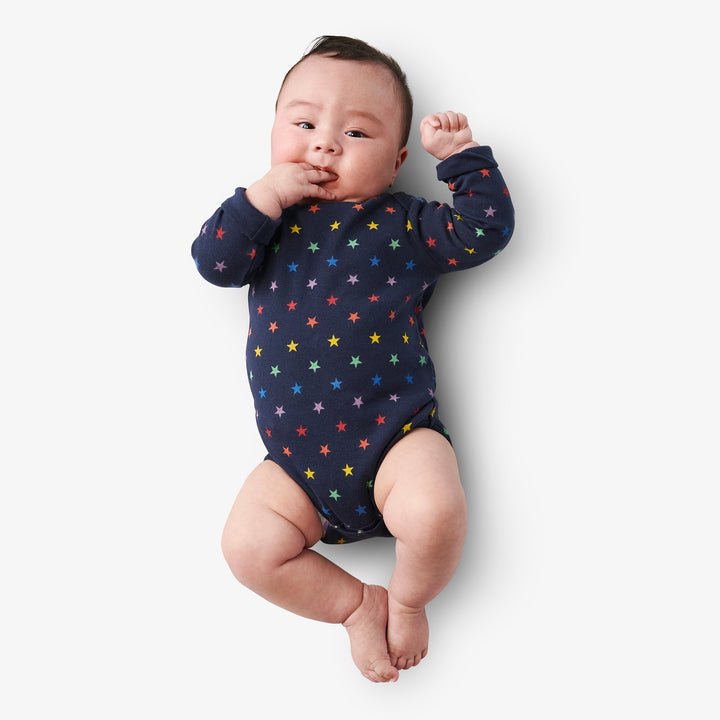 Organic long sleeve babysuit in mini rainbow stars