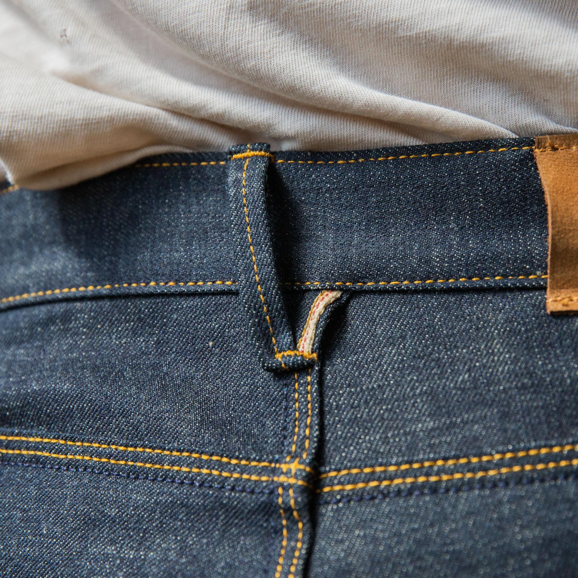 Jeans with loop on back outlet pocket