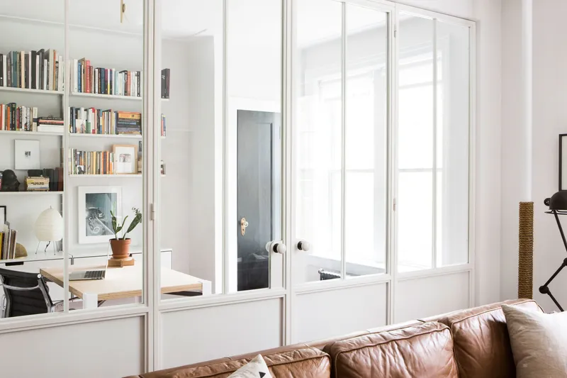 white room with shelving by Space Exploration Design