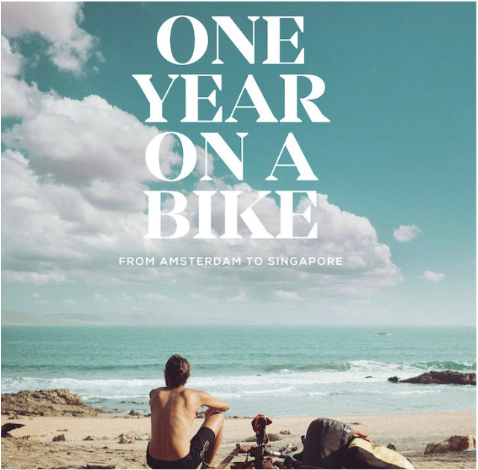 A book cover featuring a man on a beach with his bike.