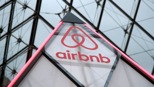 An Airbnb logo appears on a triangular stucture