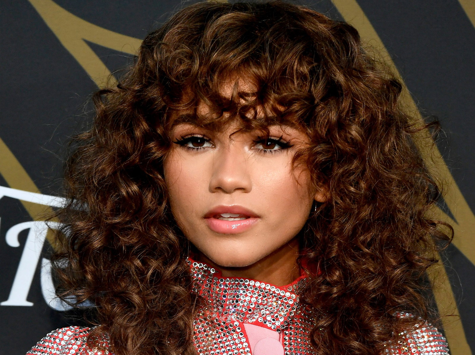 Image may contain: Zendaya, Human, Person, Premiere, Fashion, Home Decor, Hair, and Face