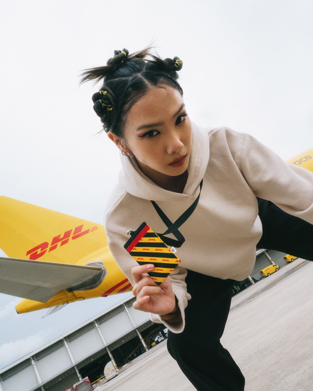 DHL and Christy Ng unveil eye-catching collection inspired by couriers - PR  Newswire APAC